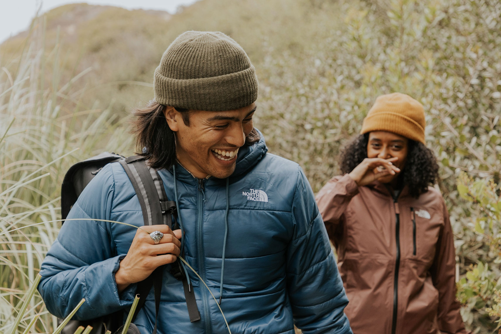 Jordan and Dani-lifestyle travel photographer and director duo-cheerful couple hiking 